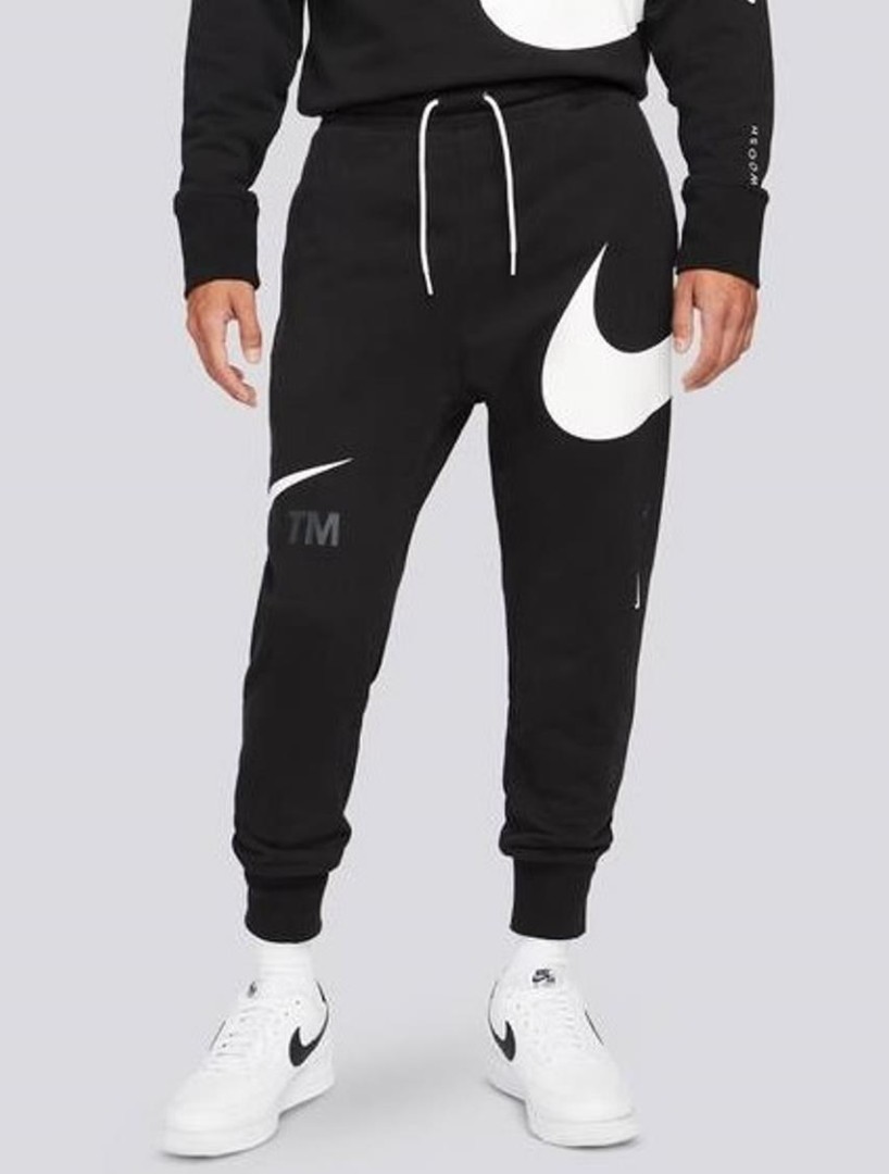 Свободные черные брюки Nike Sportswear с резинкой внизу